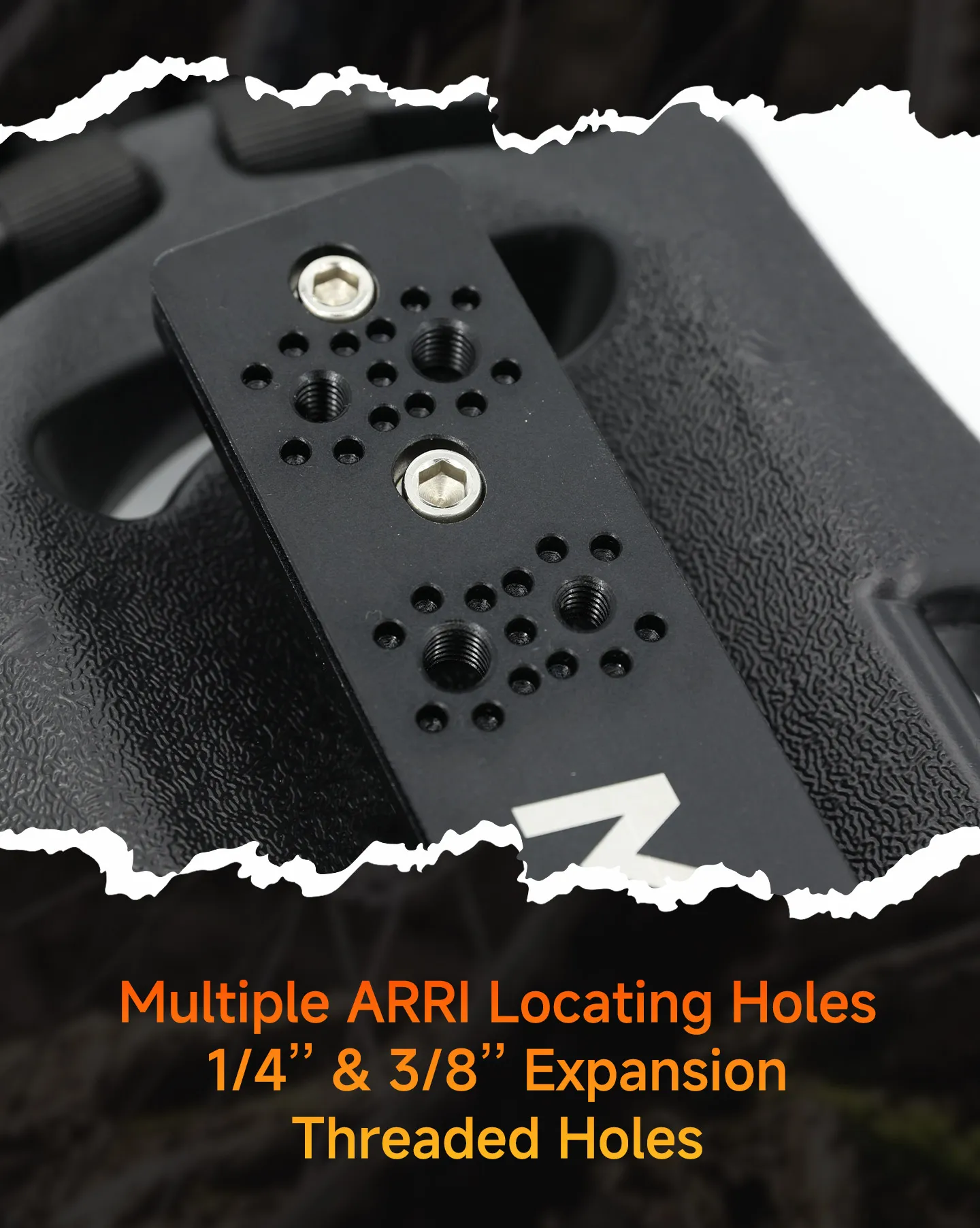Close-up of the Movmax mounting plate showing multiple ARRI locating holes plus 1/4 inch and 3/8 inch threaded holes.